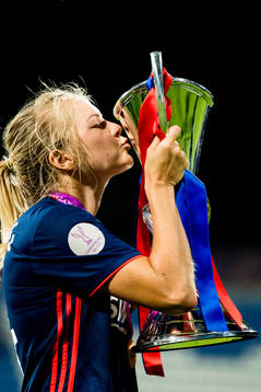 Ada Hegerberg of Lyon celebrates with the trophy