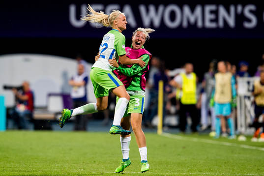 Pernille Harder of Wolfsburg celebrates with teammate