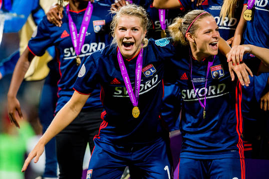 Ada Hegerberg and Eugénie Le Sommer of Lyon celebrate