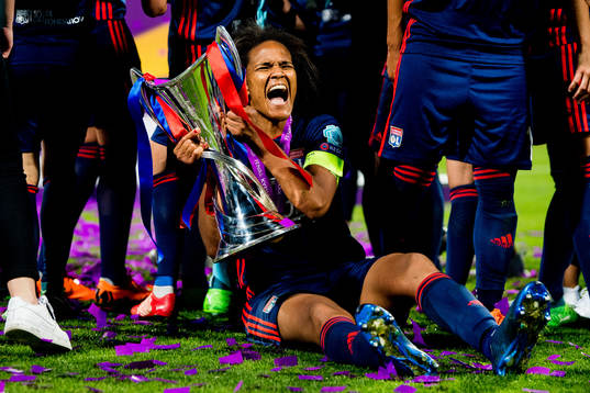 Wendie Renard of Lyon celebrates with the trophy