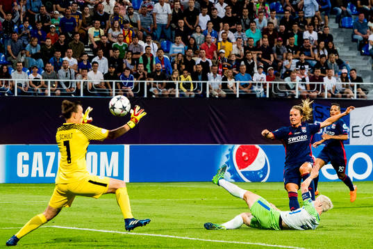 Amandine Henry of Lyon scores 1-1 behind goalkeeper Pauline