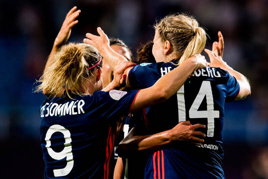 Ada Hegerberg of Lyon celebrates with teammate Eugénie Le