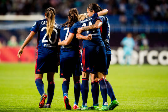 Ada Hegerberg of Lyon celebrates with teammates Delphine