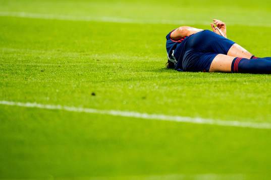 Lucy Bronze of Lyon lies down with an injury