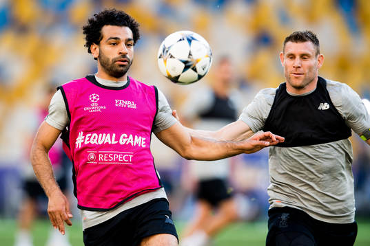 Mohamed Salah and James Milner of Liverpool