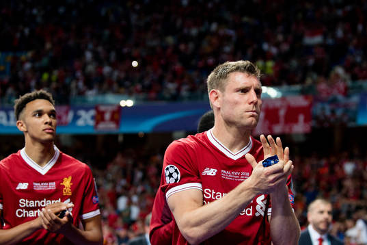 James Milner of Liverpool looks dejected