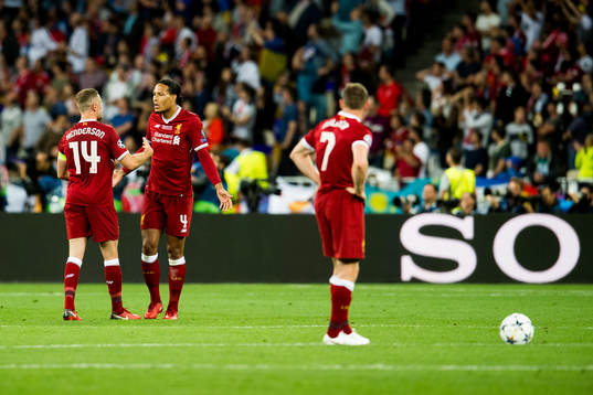 Jordan Henderson and Virgil Van Dijk of Liverpool look