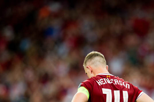 Jordan Henderson of Liverpool looks dejected