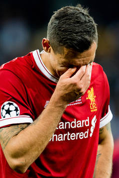 Dejan Lovren of Liverpool looks dejected