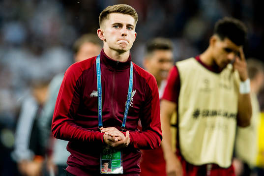 Ben Woodburn of Liverpool looks dejected