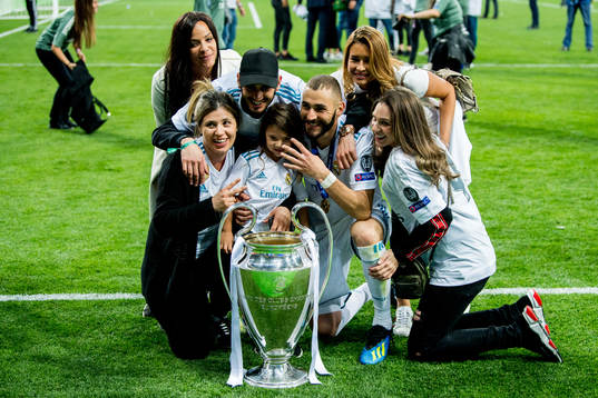 Karim Benzema of Real Madrid celebrates with the trophy