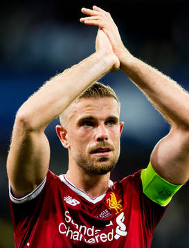 Jordan Henderson of Liverpool looks dejected
