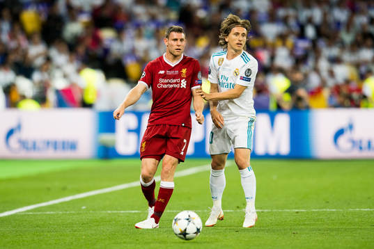James Milner of Liverpool and Luka Modric of Real Madrid