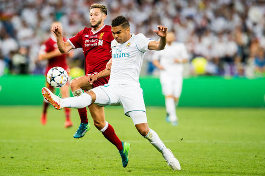 Adam Lallana of Liverpool and Casemiro of Real Madrid