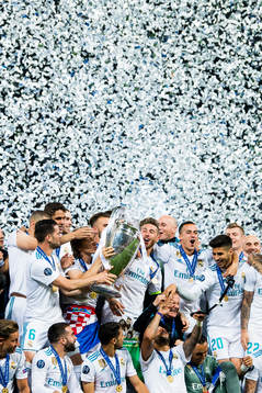 Players of Real Madrid celebrate with the trophy