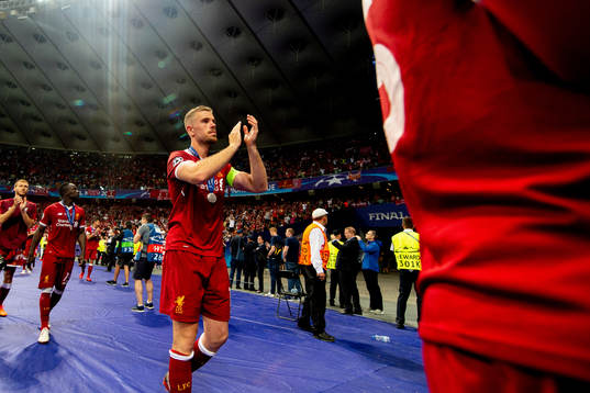 Jordan Henderson of Liverpool looks dejected