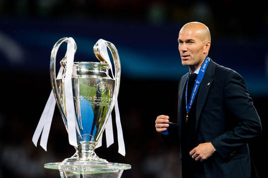 Zinedine Zidane, head coach of Real Madrid, with the trophy