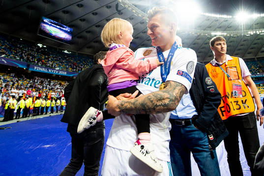 Toni Kroos of Real Madrid celebrates with his child