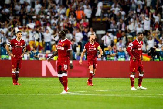 Jordan Henderson of Liverpool looks dejected
