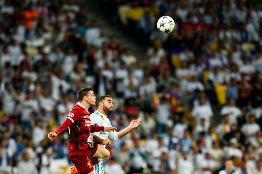Andy Robertson of Liverpool and Dani Carvajal of Real Madrid