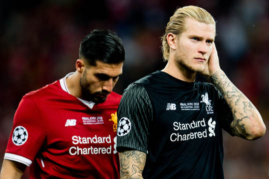 Goalkeeper Loris Karius and Emre Can of Liverpool look