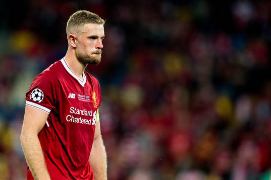 Jordan Henderson of Liverpool looks dejected