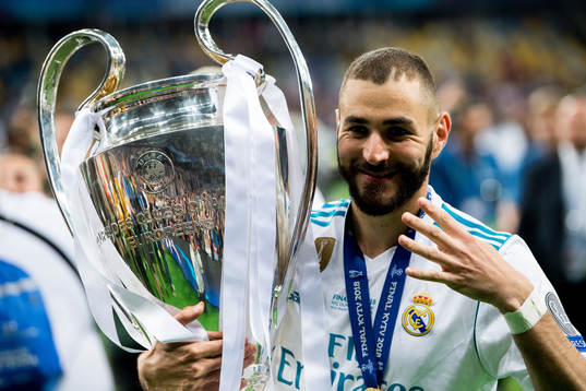Karim Benzema of Real Madrid celebrates with the trophy