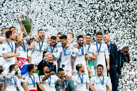 Players of Real Madrid celebrate with the trophy