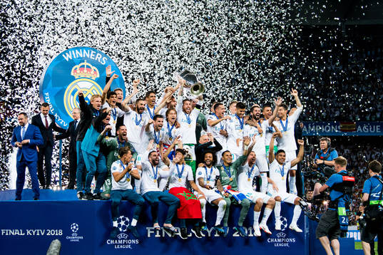 Players of Real Madrid celebrate with the trophy
