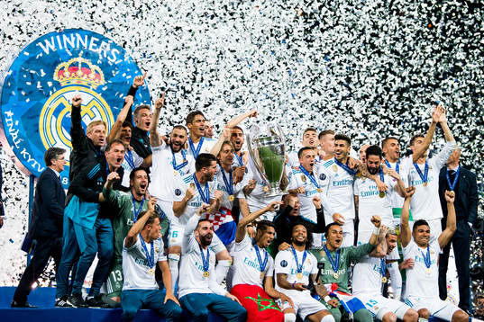 Players of Real Madrid celebrate with the trophy