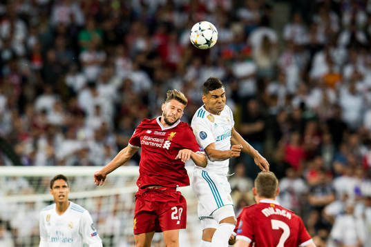 Adam Lallana of Liverpool and Casemiro of Real Madrid