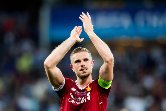 Jordan Henderson of Liverpool looks dejected