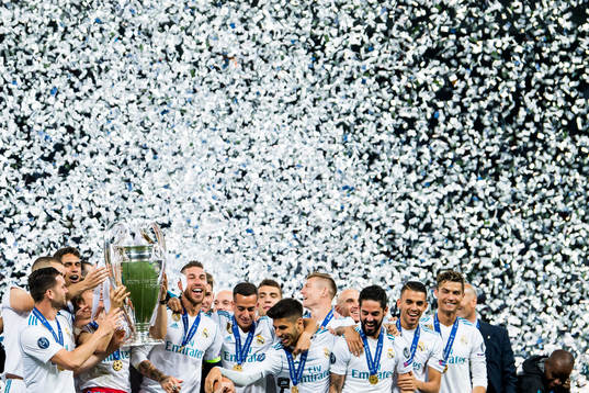 Players of Real Madrid celebrate with the trophy