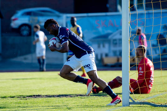Aniekpeno Udoh of Viking celebrates