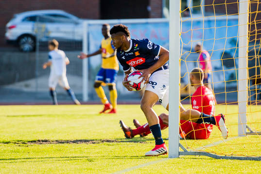 Aniekpeno Udoh of Viking celebrates