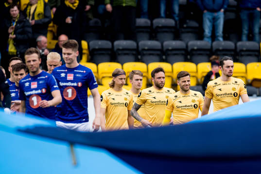 The teams enter the pitch