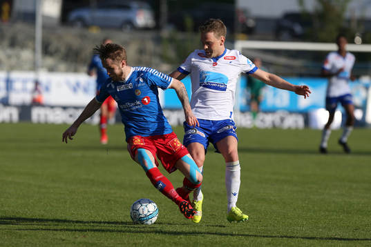 Daniel Berntsen of Tromsø in action against Joakim Nilsen