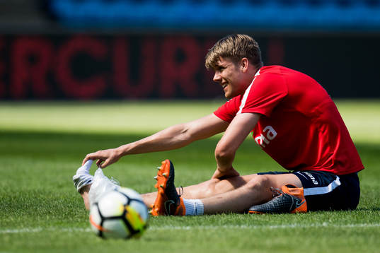 Kristoffer Ajer of Norway with an injury