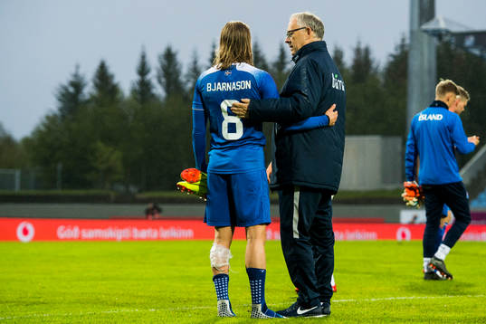 Birkir Bjarnason of Iceland and Lars Lagerbäck, head coach