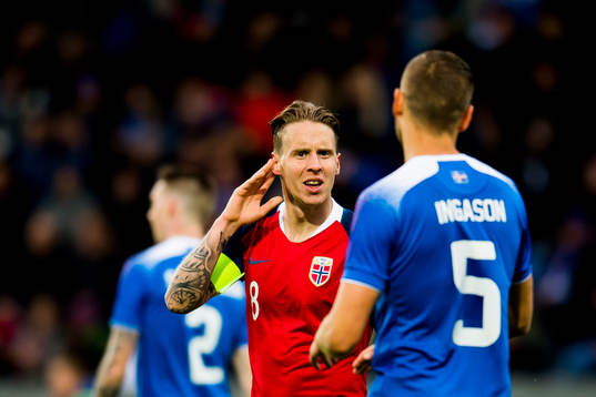 Stefan Johansen of Norway and Sverrir Ingason of Iceland