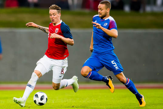 Stefan Johansen of Norway and Sverrir Ingason of Iceland