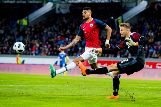 Bjørn Maars Johnsen of Norway and goalkeeper Frederik