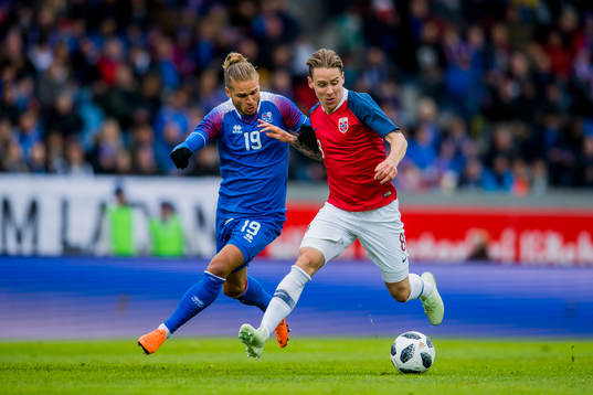 Rúrik Gíslason of Iceland and Stefan Johansen of Norway