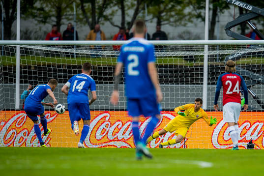 Ottar Magnus Karlsson of Iceland scores 1-1 behind