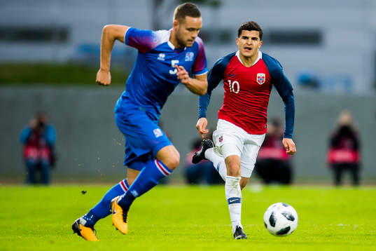 Sverrir Ingason of Iceland and Tarik Elyounoussi of Norway