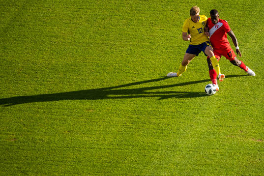 Emil Forsberg of Sweden competes for the ball with Luis