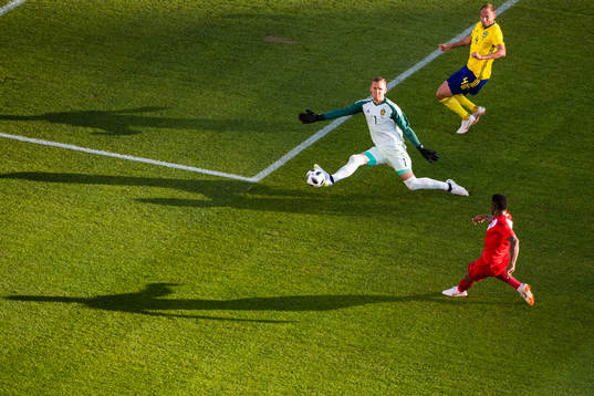 goalkeeper Robin Olsen of Sweden saves a shot from