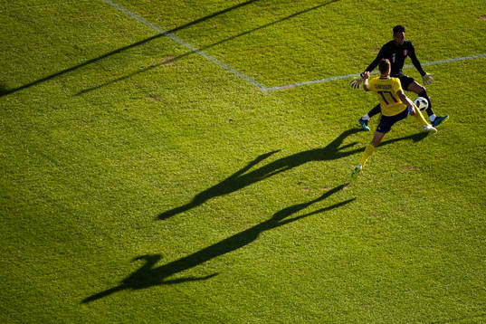 Viktor Claesson of Sweden challenges goalkeeper Pedro