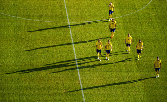 The Swedish players leave the pitch