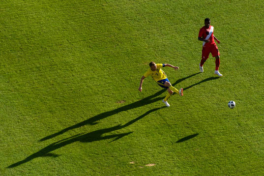 Sebastian Larsson of Sweden and Jefferson Farfan of Peru